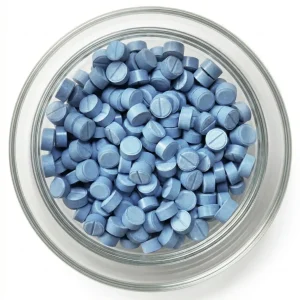 Blaue 2C-G-5 Pellets 7mg mit Bruchkerbe in einer Glasschale